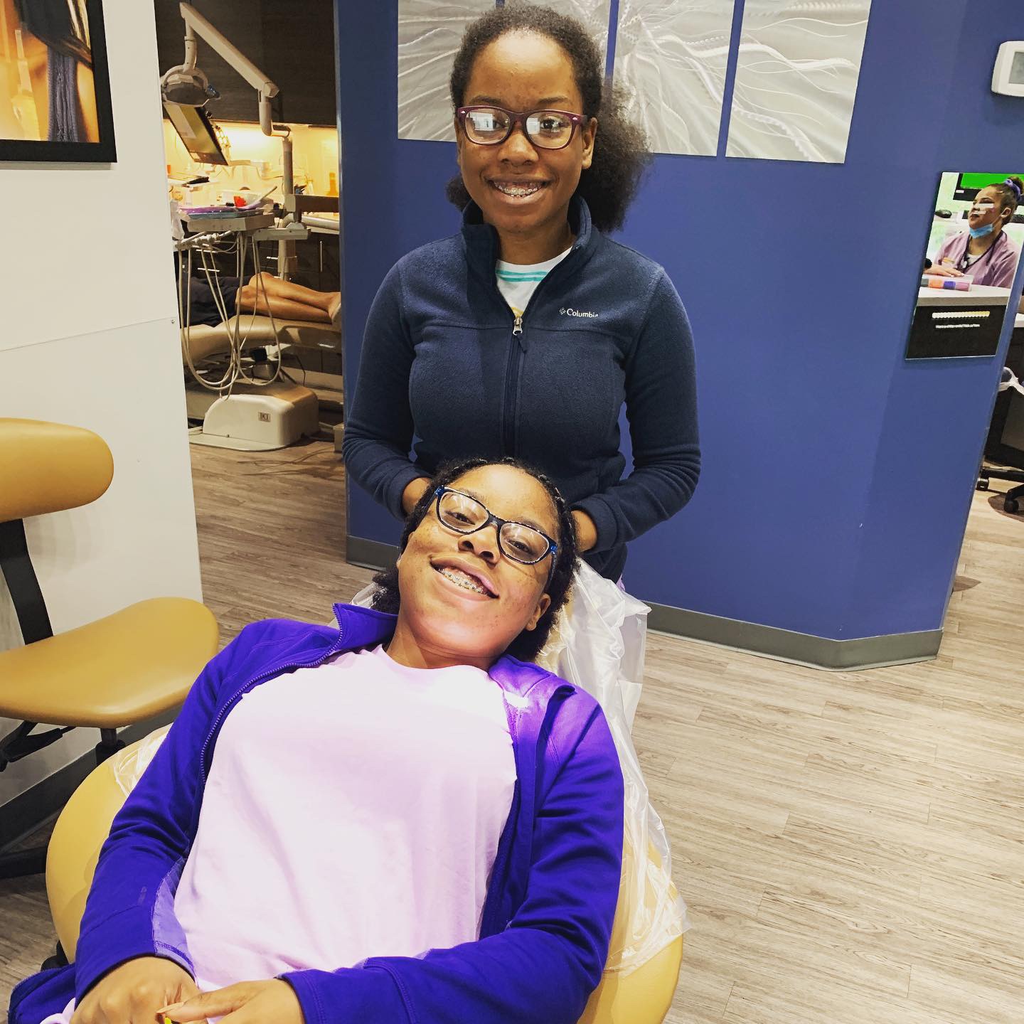 Smiling patients with braces at the Dental Care Orthodontics Stamford office