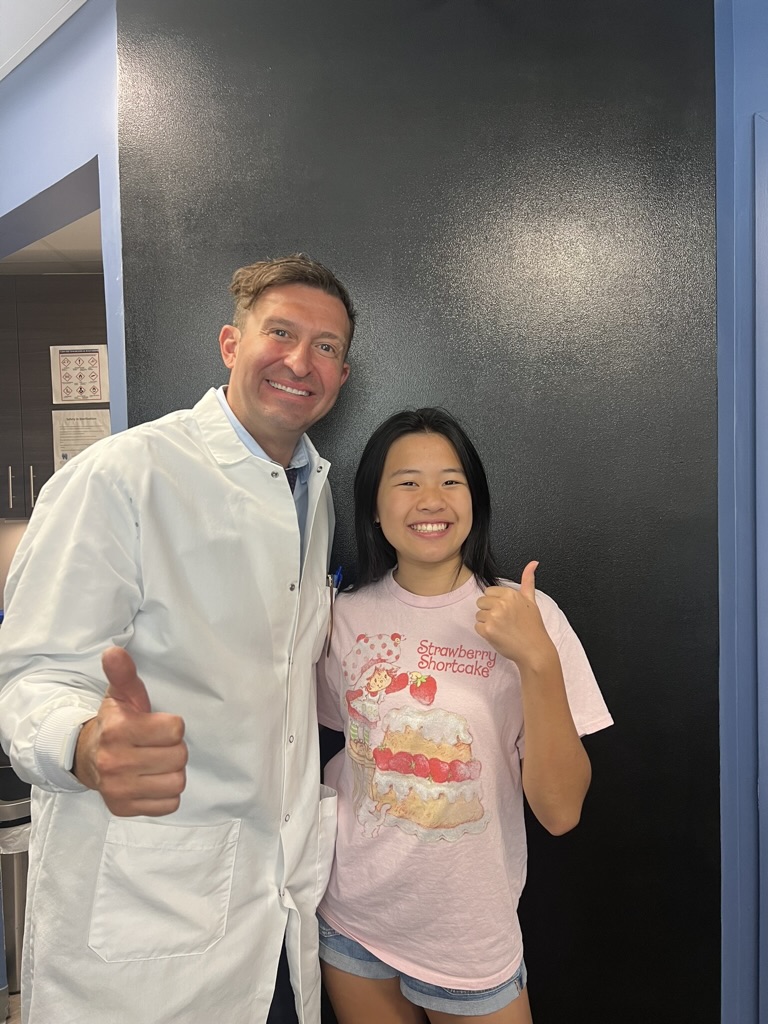 Dr. Peter Feibish with a happy patient giving a thumbs up