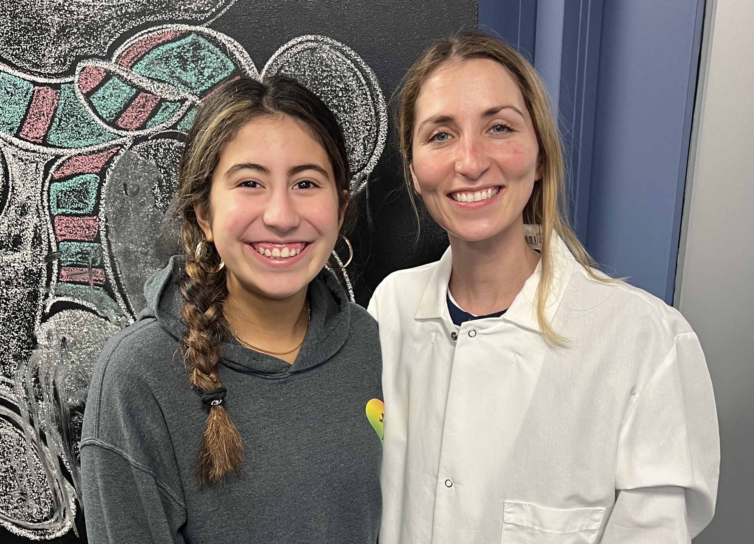 Dr. Gina Gill celebrating a patient's braces-off day