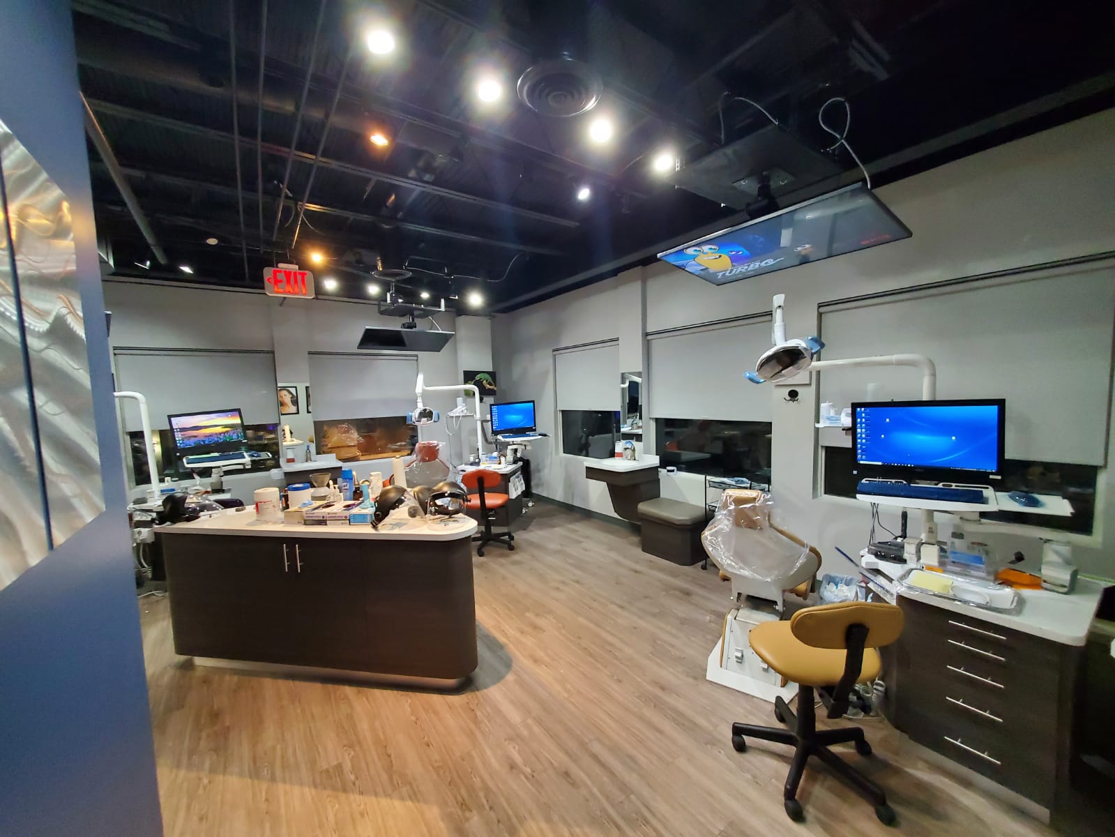 Kid-friendly overhead TVs above every treatment chair